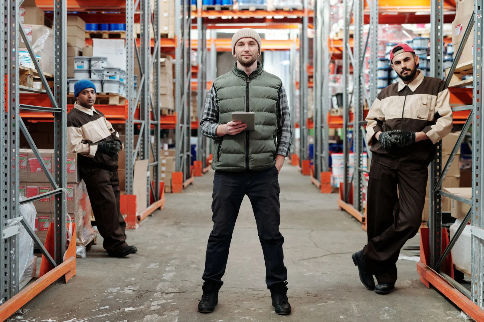 Warehouse team managing stock with a tablet